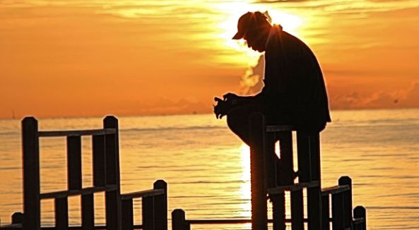 man-praying-sunrise-rgbstock